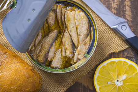 sprats in a jar with lemonの写真素材
