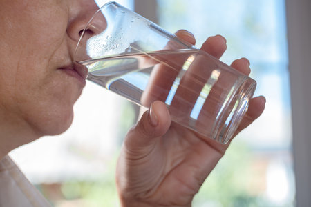 a woman drinks clean waterの写真素材