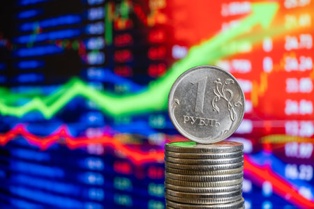 Coin stack on the background of the stock exchange chart. The concept of financial investment.の写真素材
