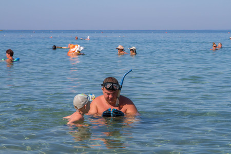 Turkey. Antalya. 16 September 2016 Beach, sea, sun, summer, man and son diveのeditorial素材