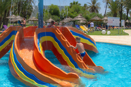 June 25, 2017. Tunisia. Children bathe in the pool, in the water parkのeditorial素材