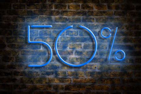 Neon numbers 50 on a brick wall background. Concept trade, discounts. Salesの写真素材