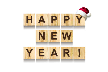 Happy New Year. Words made up of alphabet on wooden cubes. White background. Isolated. Christmas, New Year background. Vacation.の写真素材