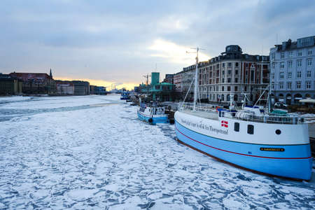 Copenhagen. Denmark March 3, 2018. Copenhagen frozen canal with beautiful ships. Natural phenomena. Architecture Seasonsの写真素材