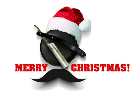 Razor on a plate for foam with a Santa Claus hat on a white background. Inscription Merry Christmas. Greeting card Happy New Year and Merry Christmas for a hairdresser and barber shop. Isolatedの写真素材