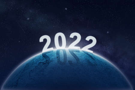 2022, numbers on the planet in space. New Year concept. Abstract background with stars and planet....