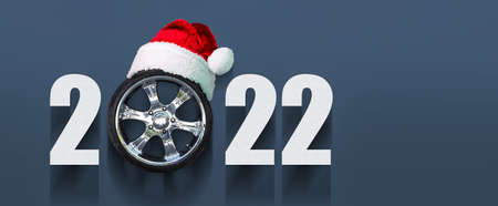 2022 Auto wheel in Santa's hat. New Year banner for auto workshop, auto shop. Copy space. Place for...