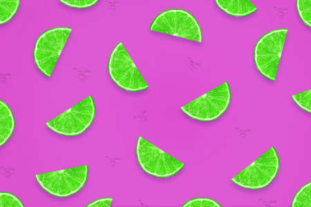 Sliced juicy lime on a purple background. Fresh fruit. Fruit background. Summer...