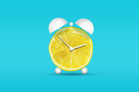 Lemon in the form of an alarm clock. Healthy eating concept. Diets Fresh natural fruits. Fruit background.の写真素材