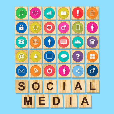 Social media concept with social icons on wooden blocks. Blue background. Communication tools.の写真素材