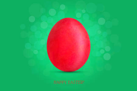 Red easter egg on green background. Easter background. Greeting card. Festive background.の写真素材
