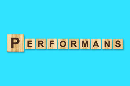 Performance. Words written on a wooden block. Blue background. Isolated. Business concept. Performance conceptの写真素材