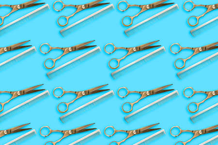 Barber shop background. Hairdressing scissors and comb on a blue background. Beauty and fashion background. Background.の写真素材