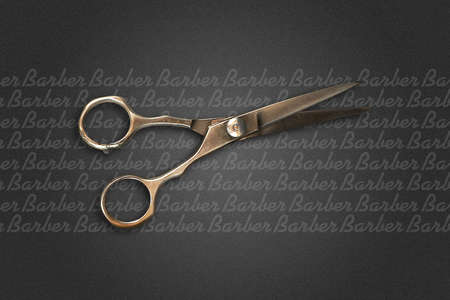 Hairdressing scissors on a dark background. Barber Shop background. Copy space. Beauty and fashion background. Background.の写真素材