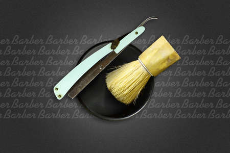 Shaving brush and razor on a dark background. Barber Shop background. Copy space. Beauty and fashion background. Background.の写真素材