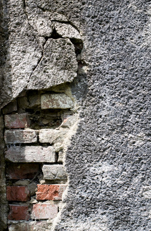 Old red brick with concrete crack. Grunge background