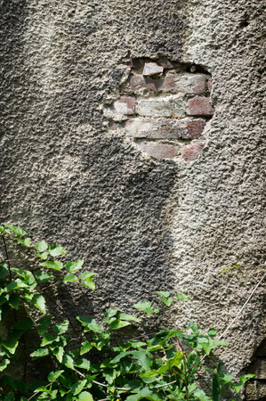Old red brick with concrete crack. Grunge backgroundの写真素材
