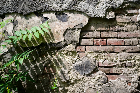 Old red brick with concrete crack. Grunge backgroundの写真素材