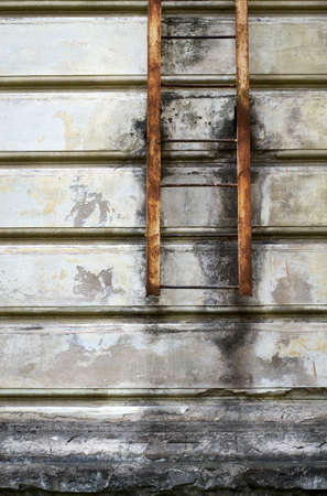 Fire escape on an old wall. Grunge backgroundの写真素材