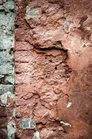 Old red brick with concrete crack. Grunge backgroundの写真素材