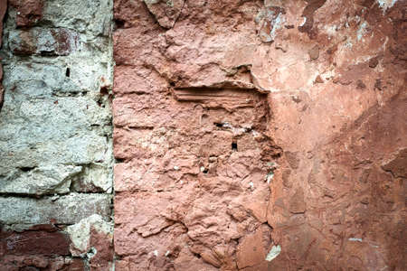 Old red brick with concrete crack. Grunge backgroundの写真素材