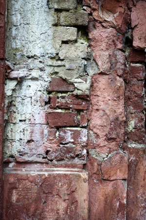 Old red brick with concrete crack. Grunge backgroundの写真素材