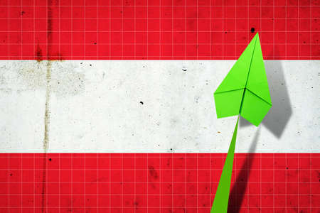 Upward arrow on the background of the flag of Austria. Paper plane. Economic recovery. Copy space.3D illustration. Business.の写真素材