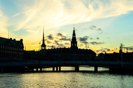 City of Copenhagen. Beautiful silhouettes of historical buildings over the canal at sunset. Denmark. European architecture. Architecture.の写真素材