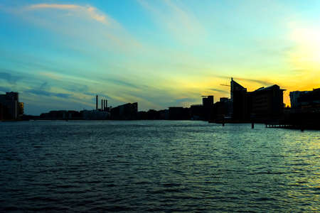City of Copenhagen. Beautiful silhouettes of modern buildings over the canal at sunset. Denmark. European architecture. Architecture.の写真素材