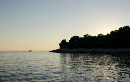 Yacht in the sea on a bright sunny dayの写真素材