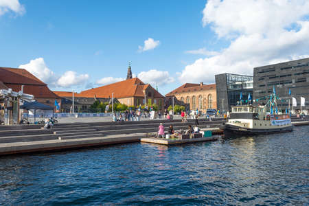 Copenhagen. Denmark. 12. September. 2021. People are resting near beautiful modern building of the Black Diamond Library. Copenhagen. Denmark. Sights. Europe.のeditorial素材