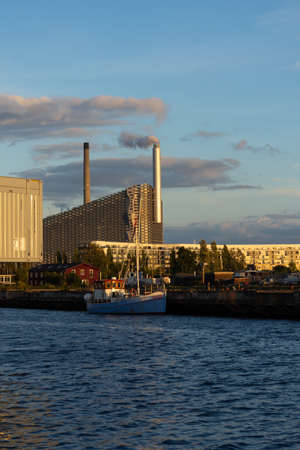 Copenhagen. Denmark. 12. September. 2021. Beautiful view On the Sunset of Amager Bakke factory with skiing slope on the rooftop in Copenhagen, Denmark. Sights. Europe.のeditorial素材