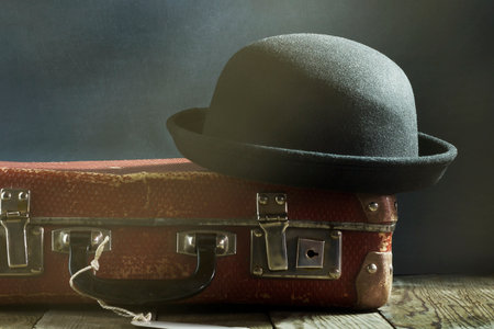 Old vintage suitcase on a wooden floor.Travel concept with a place for the textの写真素材