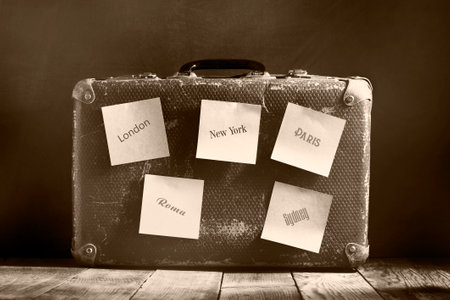 Old vintage suitcase on a wooden floor.Travel concept with a place for the text.Sepia toningの写真素材