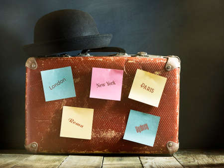 Old vintage suitcase on a wooden floor.Travel concept with a place for the textの写真素材