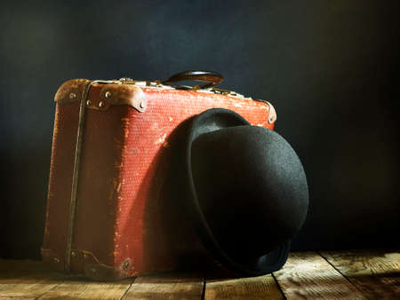 Old vintage suitcase on a wooden floor.Travel concept with a place for the textの写真素材