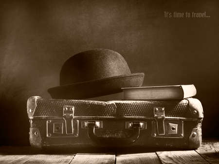 Old vintage suitcase on a wooden floor.Travel concept with a place for the text.Sepia toningの写真素材