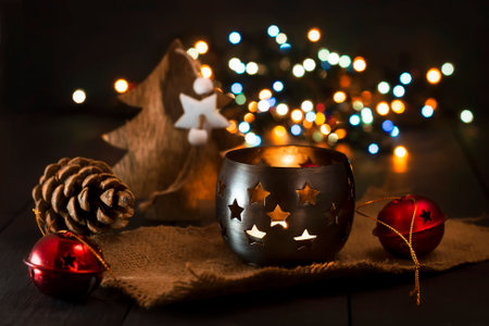 Christmas New Year composition with a candle and fir cones on a dark background. Greeting card. Christmas, New Year background with copy space.の写真素材