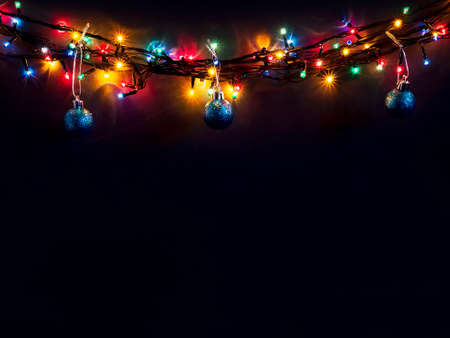 Luminous Christmas gerland on a dark background. Copy space.Christmas, New Year's background.Christmas cardの写真素材