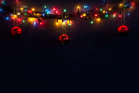 Luminous Christmas gerland on a dark background. Copy space.Christmas, New Year's background.Christmas cardの写真素材
