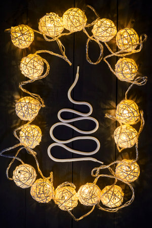 Glowing New Year garlands and ornaments on a dark background. Copy space.Holidays.Christmas, New Year. Cardの写真素材