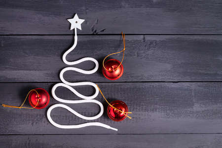 Sign symbol Christmas tree on a wooden background. A copy of space. The idea of a merry new year....