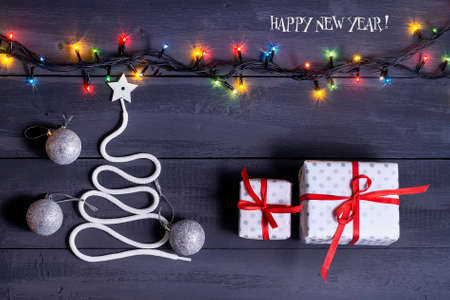 Sign symbol Christmas tree on a wooden background. A copy of space. The idea of a merry new year. Christmas. Greeting card.の写真素材