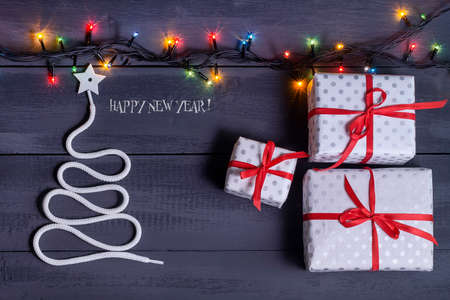 Sign symbol Christmas tree on a wooden background. A copy of space. The idea of a merry new year. Christmas. Greeting card.の写真素材