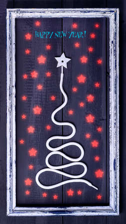 Sign symbol Christmas tree on a wooden background. A copy of space. The idea of a merry new year. Christmas. Greeting card.の写真素材
