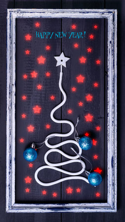 Sign symbol Christmas tree on a wooden background. A copy of space. The idea of a merry new year. Christmas. Greeting card.の写真素材
