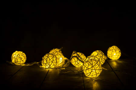 Luminous Christmas gerland on a dark background. Copy space.Christmas, New Year's background.Christmas cardの写真素材