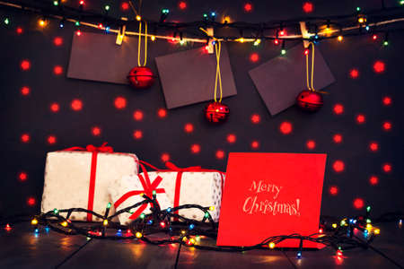 Christmas composition with gifts, Christmas toys and glowing garland. A greeting card. Holidays. Gifts.の写真素材