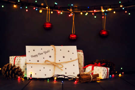 A composition with New Year's gifts and an envelope with the inscription Happy New Year Greeting...