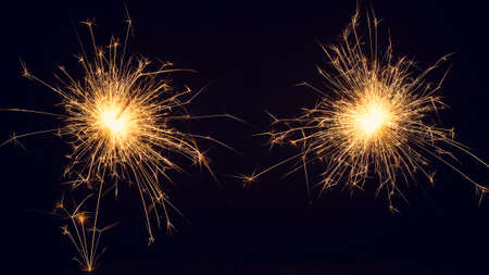 Christmas sparklers on a dark background. Copy of space. Holidays.の写真素材